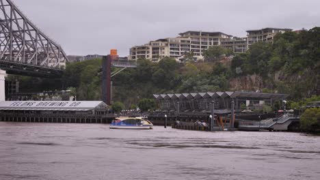 Small-ferry-arriving-at-Howard-Smith-Wharves-viewed-from-New-Farm-River-Walk