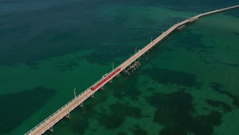 Jetty-Train-Trip-Along-Busselton-Jetty-In-Australia,-Aerial-Orbital-View