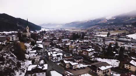 Hyper-lapse-of-iconic-Kirchberg-township-in-winter-season,-aerial