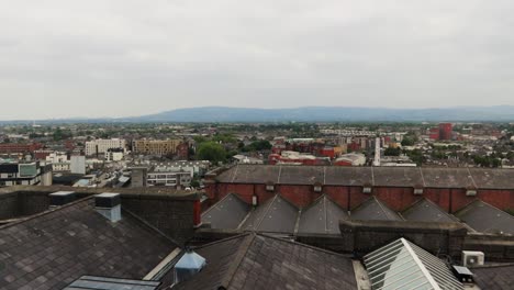 Aerial-panning-shot-of-city-rooftops-in-Dublin-on-an-Irish-cloudy-day