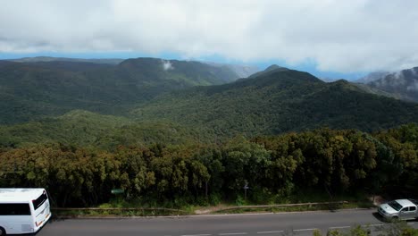 Bird’s-Eye-View-of-a-White-Bus-Journeying-Through-the-Expansive-Greenery-of-La-Gomera-Mountain-Range