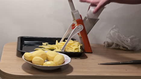 Timelapse-shot-of-slicing-potatoes-on-a-V-blade-to-grill-crispy-french-fries-at-home
