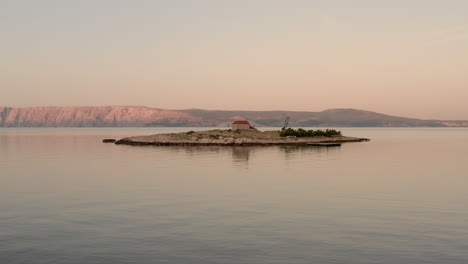 Blue-hour-view-of-a-tiny-island-in-the-middle-of-the-sea