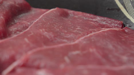Thin-Slices-Of-Raw-Beef-Meat-For-Shabu-Shabu,-Close-Up