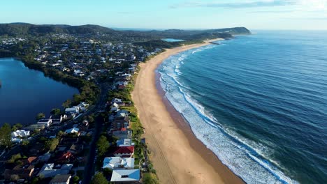 Drone-aerial-Wamberal-beach-seaside-suburban-town-lagoon-Terrigal-bridge-nature-housing-town-ocean-waves-Central-Coast-tourism-travel-Australia