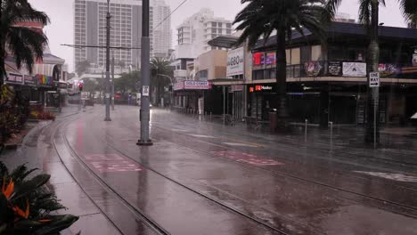 Wide-view-of-a-car-travelling-along-Surfers-Paradise-Blvd-as-heavy-rain-and-storms-continue-to-lash-the-Gold-Coast-in-ongoing-storms-and-flooding