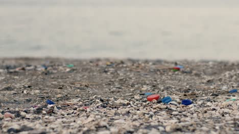 Environmental-pollution-on-Khasab-beach,-littered-seaside