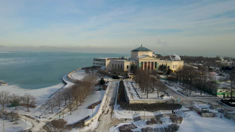 Aerial-drone-footage-of-Chicago-Adler-Planetarium-during-winter-time-with-below-zero-temperatures