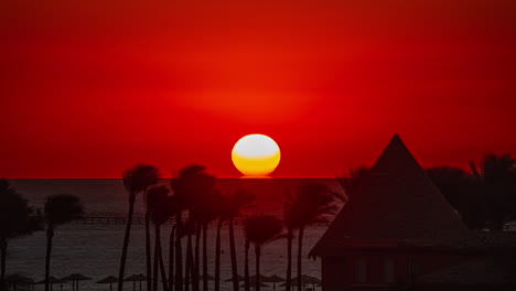 Sunrise-TimeLapse-with-Palm-Trees-and-Rooftop-Building-at-Pickalbatros-Laguna-Vista-Hotel,-Sharm-El-Sheikh,-Egypt