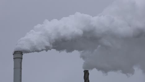 Grey-smoke-coming-out-of-a-chimney