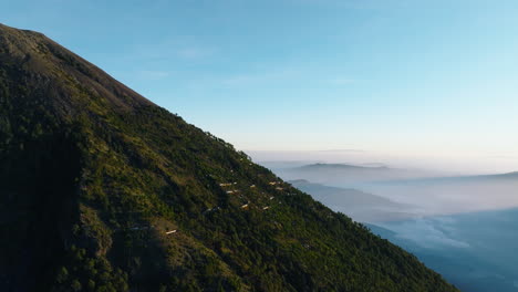 Aerial:-Shanty-houses-near-summit-of-inactive-Acatenango-volcano-in-Guatemala-during-sunrise