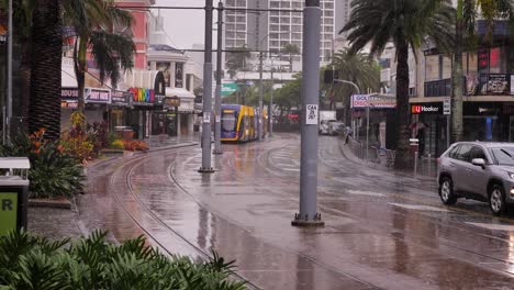 View-a-tram-and-car-moving-along-Surfers-Paradise-Blvd-as-heavy-rain-and-storms-continue-to-lash-the-Gold-Coast-in-ongoing-storms-and-flooding