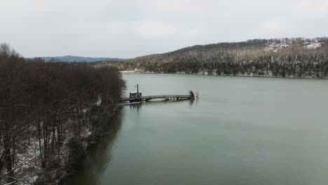 Scenic-aerial-shot-of-Lake-Sequoyah-on-a-winter-cold-day,-view-of-old-bridge