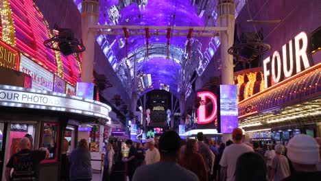 POV-Walking-Along-Illuminated-Freemont-Street-In-Las-Vegas-Soaking-Up-The-Atmosphere