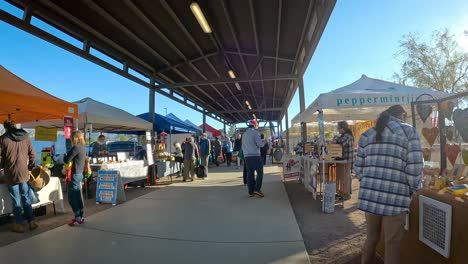 Walking-thru-a-farmer's-market-for-Southern-Arizona-farmers,-ranchers-and-artisan-food-purveyors