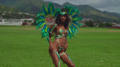 In-the-heart-of-Trinidad's-tropical-splendor,-a-young-girl-dons-her-carnival-costume,-adding-to-the-island's-festive-charm