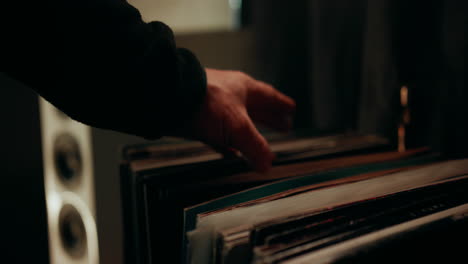 Man-choosing-a-record-from-his-big-vinyl-selection