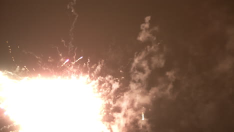 Stars-flashes-and-glowing-explosions-during-fire-work-close-up-at-night