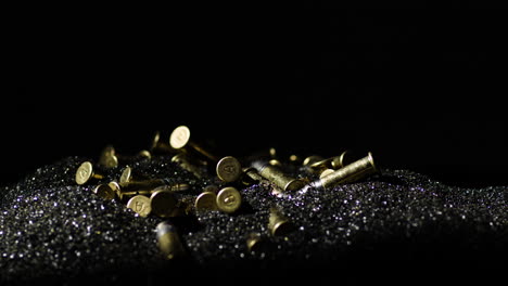 Bullets-With-A-Hallmarked-'A'-On-The-Bottom-Piled-Over-Gunpowder