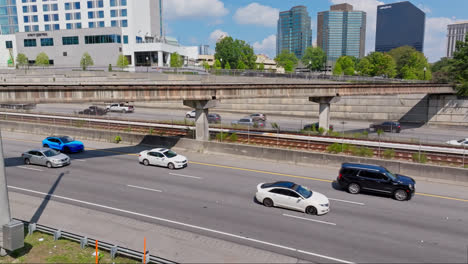 Slowly-rolling-traffic-on-american-highway-during-sunny-day