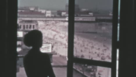 Woman-Looks-at-the-Ocean-Landscape-from-the-Window