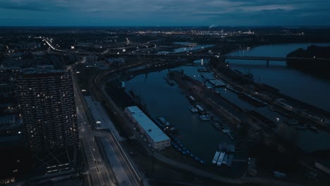 Cargo-port-on-Danube-river-at-night---aerial-drone-view