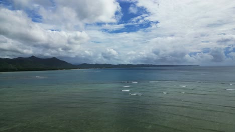 Cloudy-Sky-And-Tranquil-Sea-Near-Agojo,-San-Andres-In-The-province-Of-Catanduanes,-Philippines