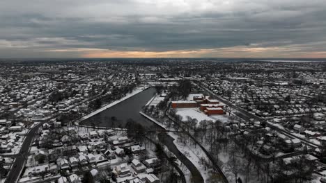 An-aerial-view-of-a-suburban-neighborhood-after-it-snowed-on-a-cloudy-day