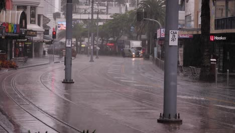 View-of-a-car-travelling-along-Surfers-Paradise-Blvd-as-heavy-rain-and-storms-continue-to-lash-the-Gold-Coast-in-ongoing-storms-and-flooding