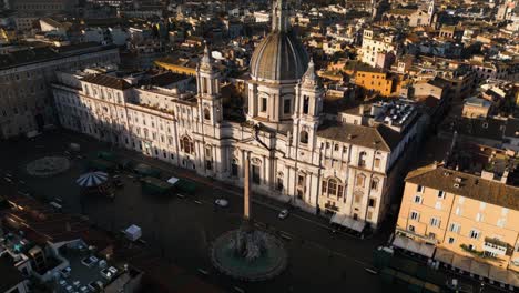 Drone-Ascends-Above-Piazza-Navona,-Fountain-of-the-Four-Rivers