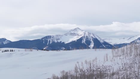 Majestic-mountain-peak-covered-in-snow,-winter-landscape