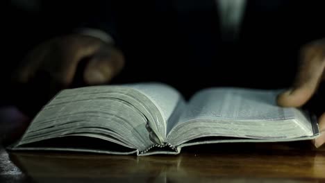 praying-to-god-with-bible-on-table-with-people-stock-video-stock-footage