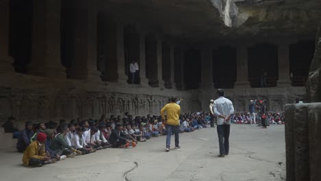 School-Students-during-an-outdoor-trip-at-Kailasha-temple,-the-largest-rock-cut-Hindu-temple-at-the-Ellora-Caves