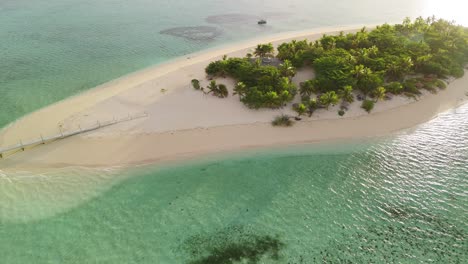 Golden-hour-sunset-seen-from-a-drone-over-private-island-resort-in-Fiji