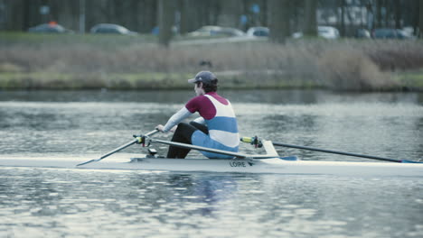 Boy-Rowing-on-the-Bosbaan-in-Amsterdam-in-Slow-Motion