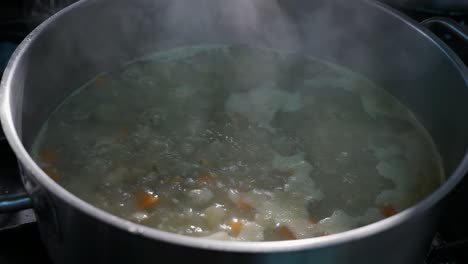 OPENING-POT-WITH-BOILING-TRADITIONAL-FOOD