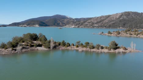 Aerial-view-of-Aoos-spring-lake-islets-Epirus-Metsovo-Greece