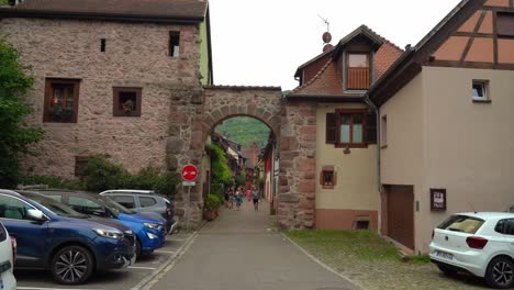 People-Entering-Kayserberg-Village-Through-Stone-Gates