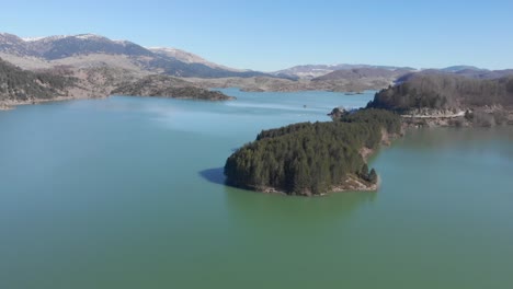 Aerial-view-of-Aoos-artificial-spring-lake-Zagori-greece-Sunny-day