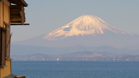 Slow-cinematic-pan-over-majestic-Mount-Fuji-over-ocean-of-Tokyo-Bay