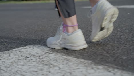 Close-up-tracking-shot-female-feet-in-running-shoes