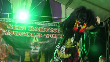 Javanese-Barongan-dancers-perform-on-a-simple-village-stage-at-night-in-Blora,-Central-Java