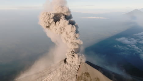 Drone-shot-of-Fuego-volcano-in-Guatemala-erupting-during-beautiful-sunrise