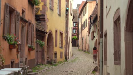 Young-Couple-Walks-Down-the-Cobble-Stone-Street-in-Riquewihr-Village