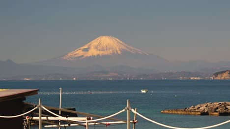 Stunning-view-out-on-Mount-Fuji-and-Enoshima-with-small-fishing-boat