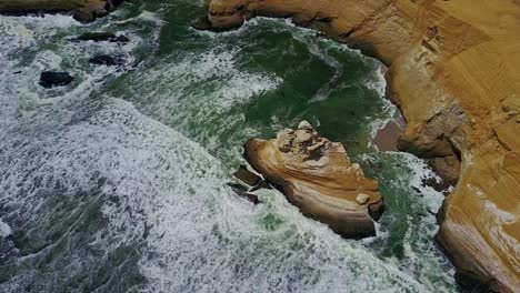 Aerial-Drone-Panning-and-Tilting-with-Beautiful-Scenic-Cliff-Views-and-La-Catedral-Rock,-Peru,-South-America