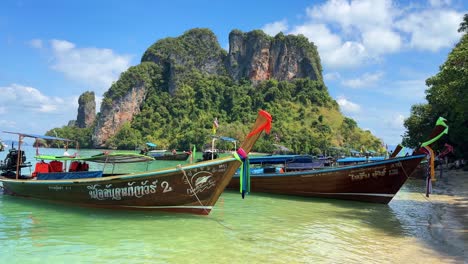 Long-Tail-boat-tourist-on-the-beach-in-shallow-water-island-Thailand-Krabi