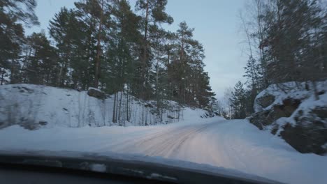 Driving-A-Car-On-Winter-Snowy-Road-In-Forest---POV