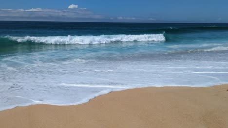 Light-surf-at-north-beach-Praia-do-Norte-on-a-sunny-and-idyllic-day