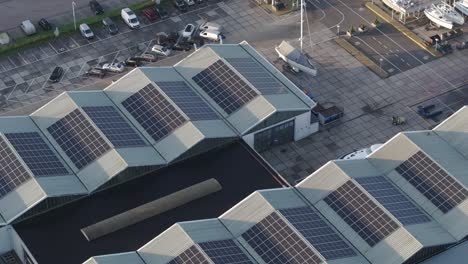 Aerial-view-of-building-with-solar-panels-stations-on-the-roof,-Netherlands